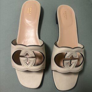 Gucci white leather cutout interlocking slides